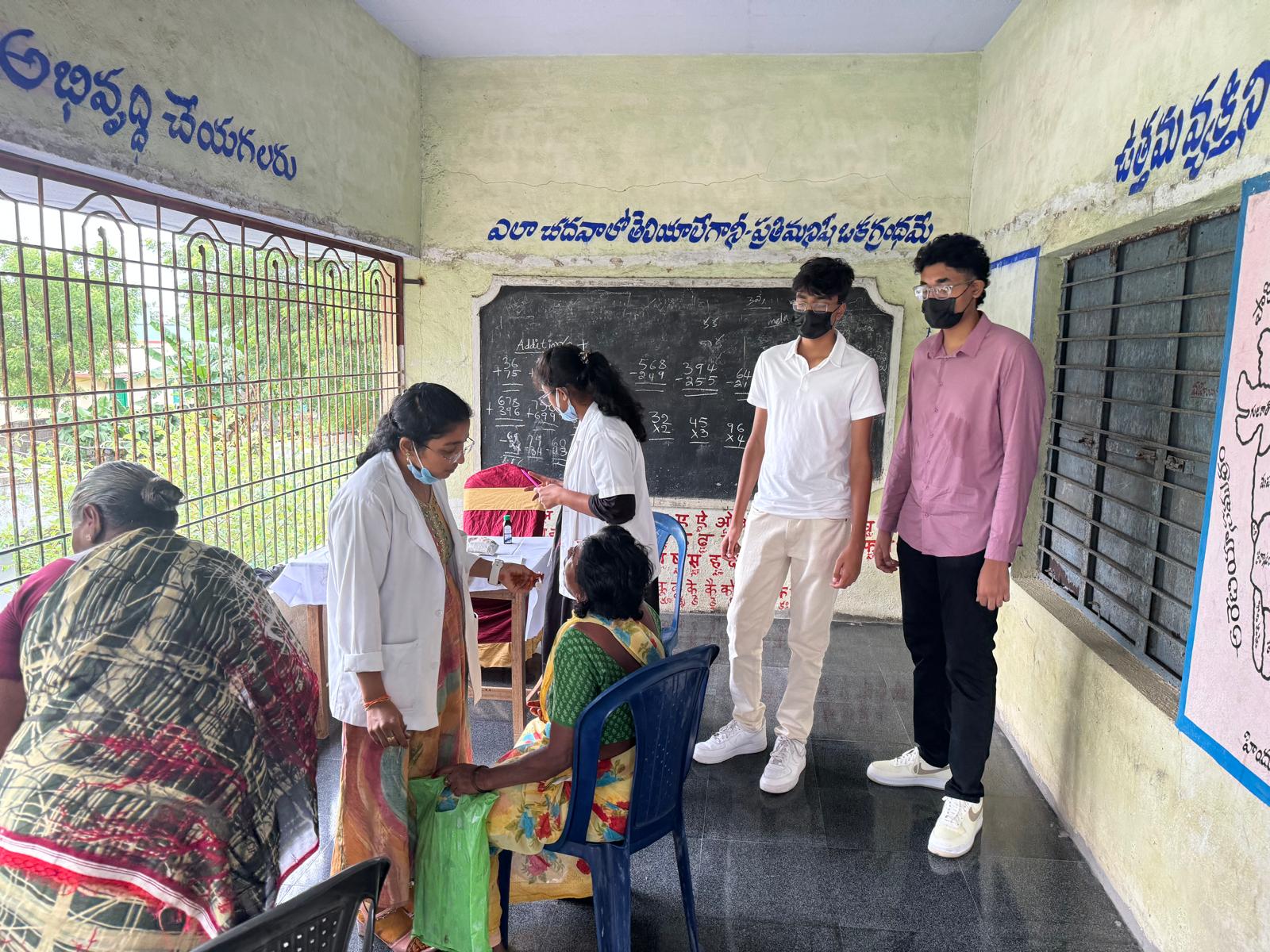 Young male doctor leading a community heart health awareness session in India